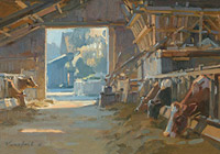 Cows in sunlit barn